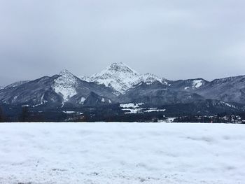 Scenic view of snowcapped mountains against sky