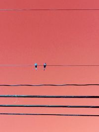 Scenic view of power lines against sky