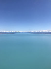 Scenic view of sea against blue sky