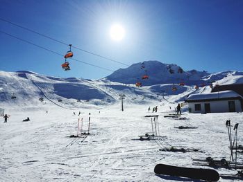 People skiing on snow covered landscape