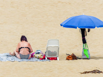 People sitting on chair at beach