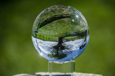 Close-up of crystal ball on glass