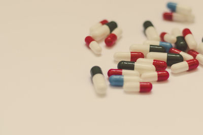 Close-up of colored object over white background