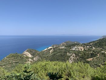 Scenic view of sea against blue sky