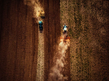 High angle view of tractors on agricultural field