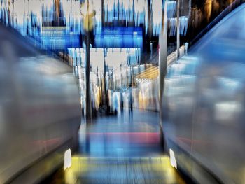Blurred motion of illuminated train station 