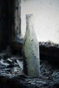 Close-up of old glass bottle