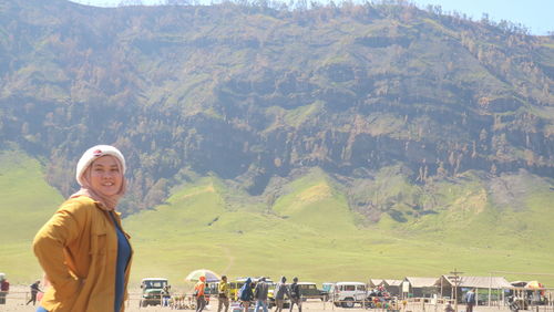 Portrait of smiling man standing on landscape