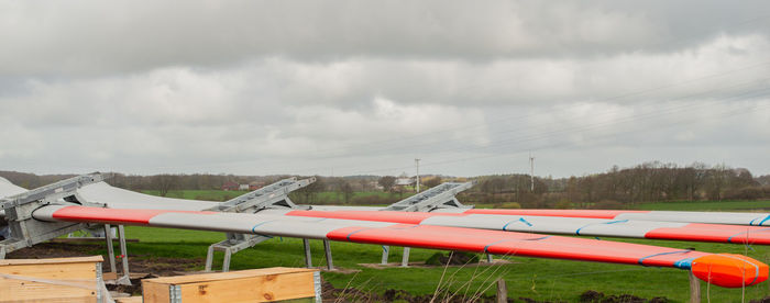 View of airplane against cloudy sky