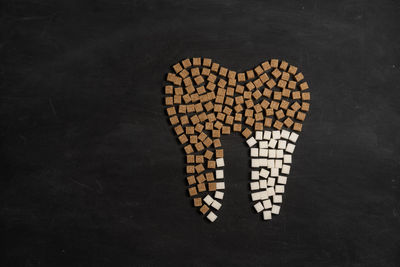 High angle view of heart shape over black background