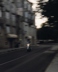 Blurred motion of people on street