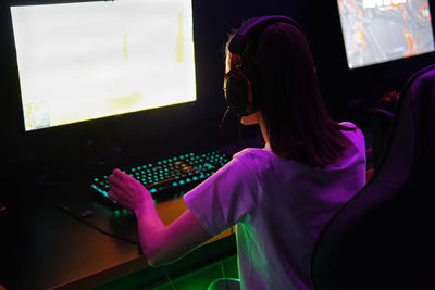 Midsection of woman using laptop