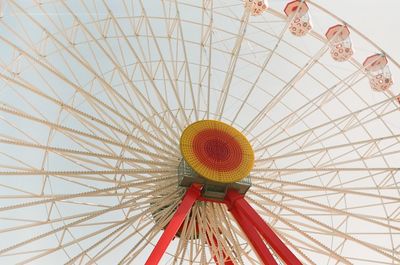 Low angle view of ferris wheel against sky