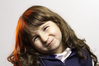 Close-up of a girl over white background