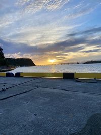 Scenic view of beach against sky during sunset