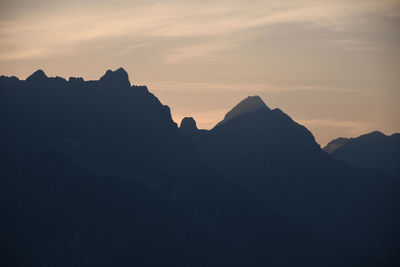 Scenic view of mountains against sky during sunset