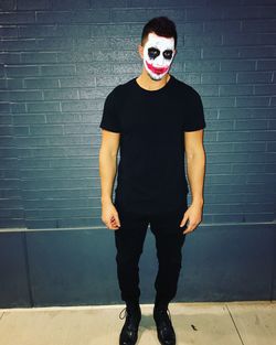 Portrait of young man with face painting during halloween