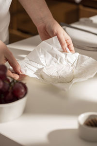 Cropped hand of woman washing hands