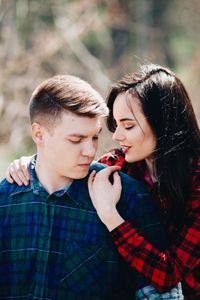 Loving young couple in forest