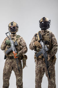 Army soldiers standing against clear sky