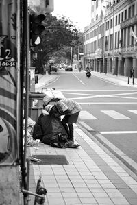 Woman standing on city street