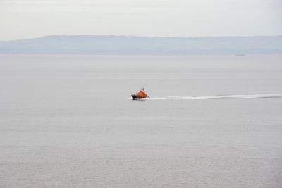 Boat on sea against sky