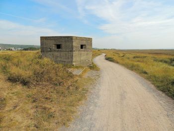 Road passing through field