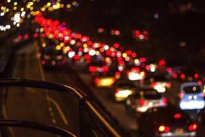 Defocused image of illuminated christmas lights at night