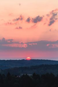 Scenic view of sea against sky at sunset