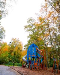 Trees in park against sky during autumn