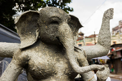 Close-up of angel statue in cemetery