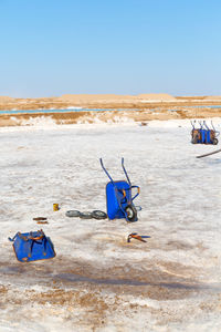 Deck chairs on sand at beach