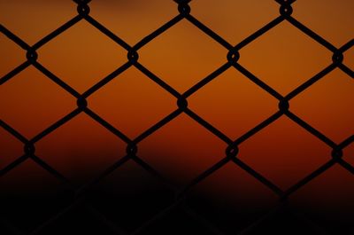 Full frame shot of chainlink fence against sky