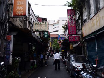 People walking on street in city