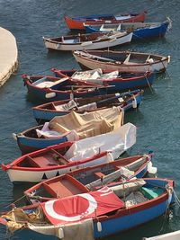 High angle view of boats moored at harbor