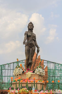 Low angle view of statue against sky