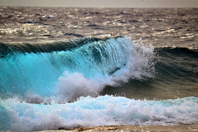 Sea waves splashing on shore