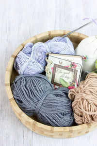 Close up view of diary and wool in wooden container