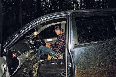 Portrait of a man sitting in car