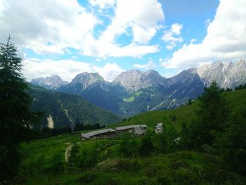 Scenic view of mountains against cloudy sky
