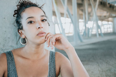 Portrait of young woman drinking water