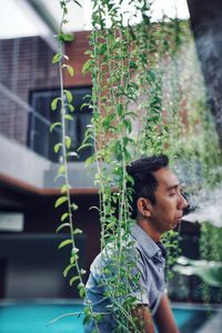 Young man looking away outdoors