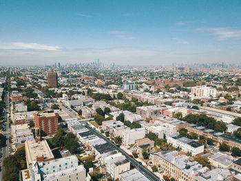 Aerial view of cityscape against sky