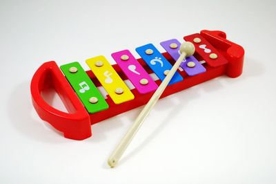 High angle view of multi colored toy on white background