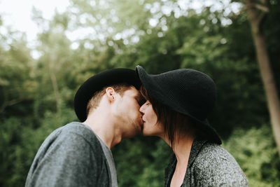 Couple kissing in park