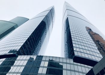 Low angle view of modern buildings against clear sky