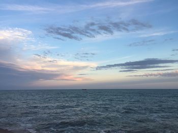 Scenic view of sea against sky at sunset
