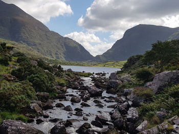 Scenic view of lake and mountains against sky
