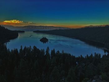 Scenic view of lake against sky at sunset