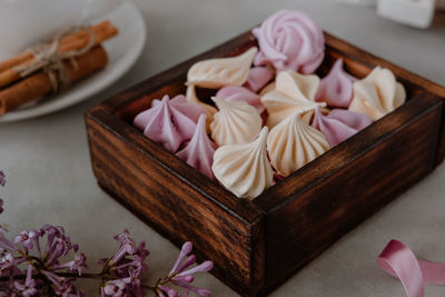 High angle view of meringues in box on table